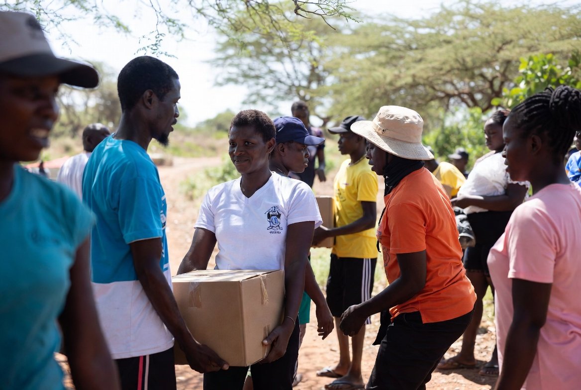 Hands joined in support for community-centered programming